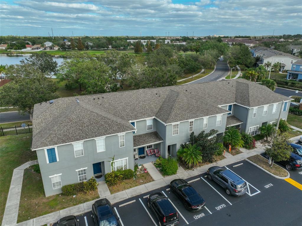 an aerial view of house with yard