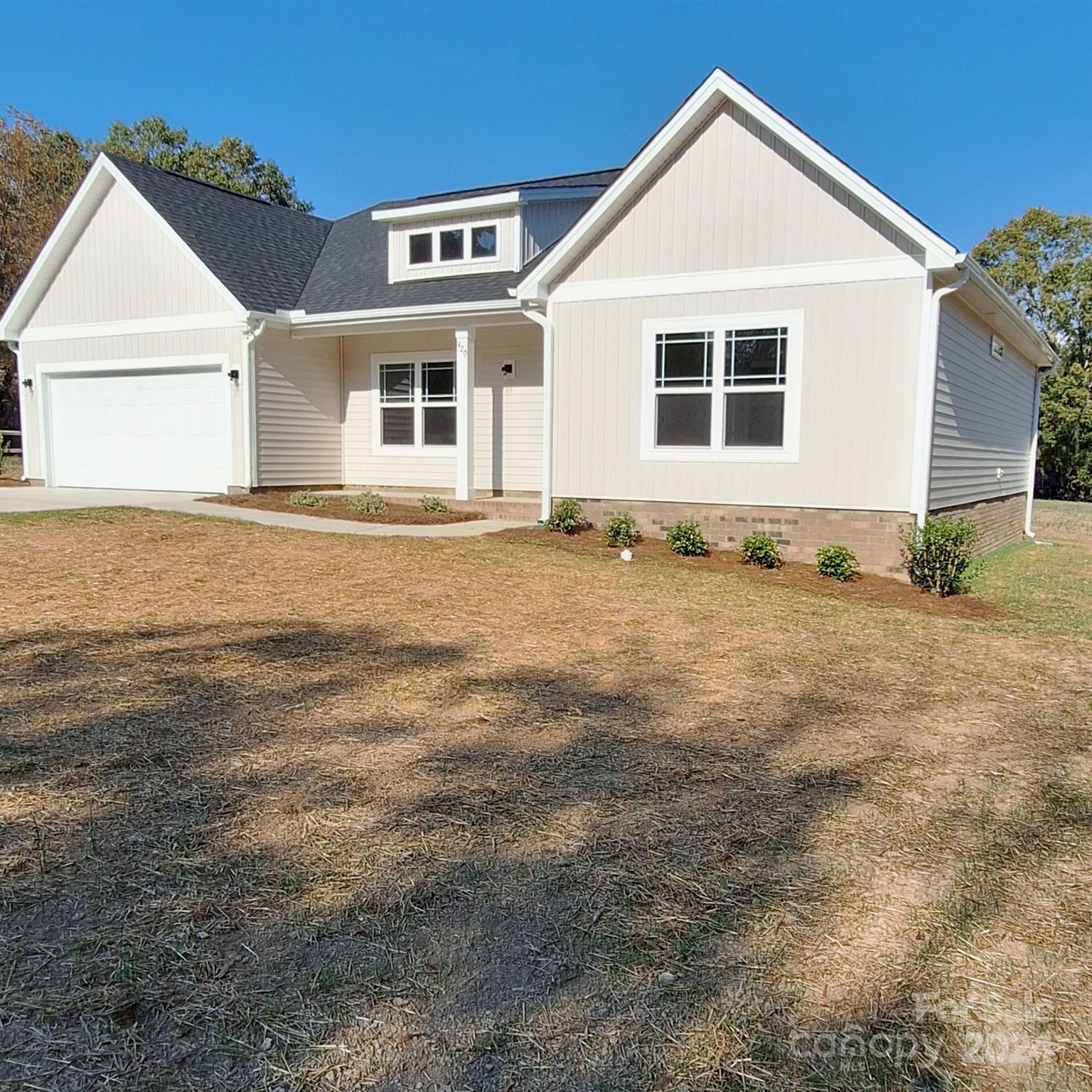 a view of an house with backyard space