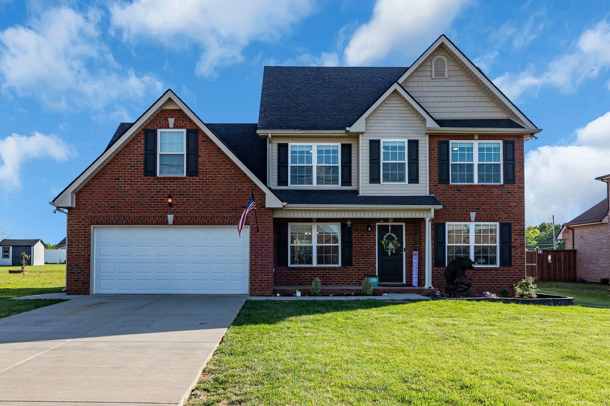 a front view of a house with a yard