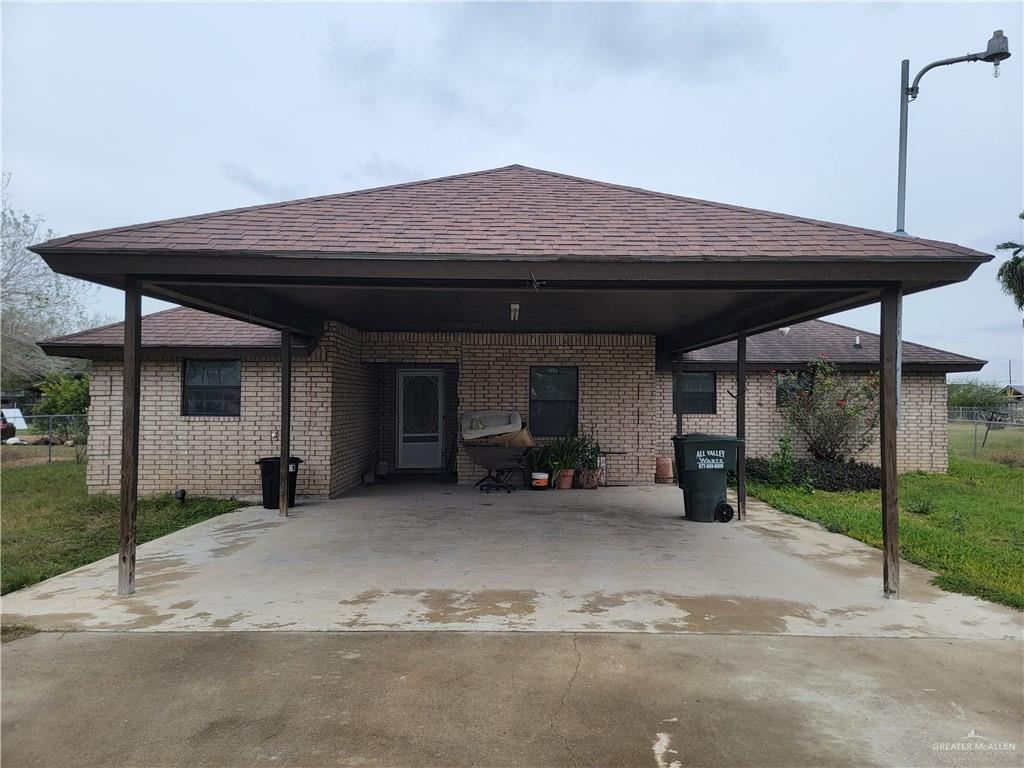 View of patio / terrace with a carport