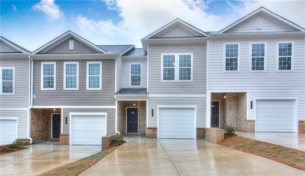 a front view of a house with a garage