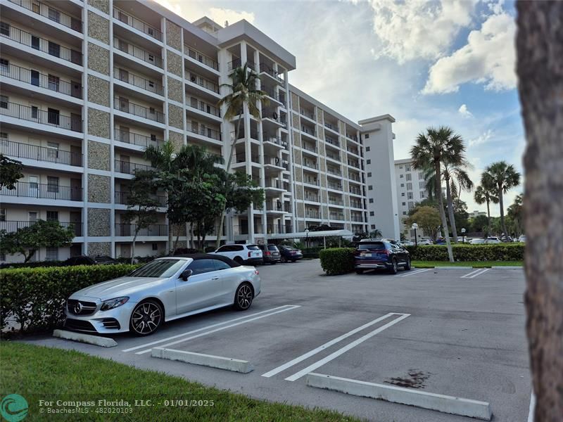 a view of a cars parked in front of a building