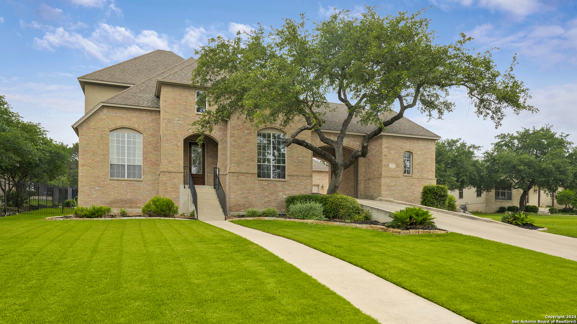 a front view of a house with garden