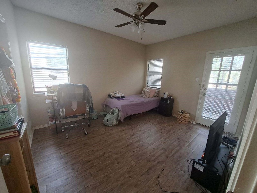 a bedroom with furniture and a window