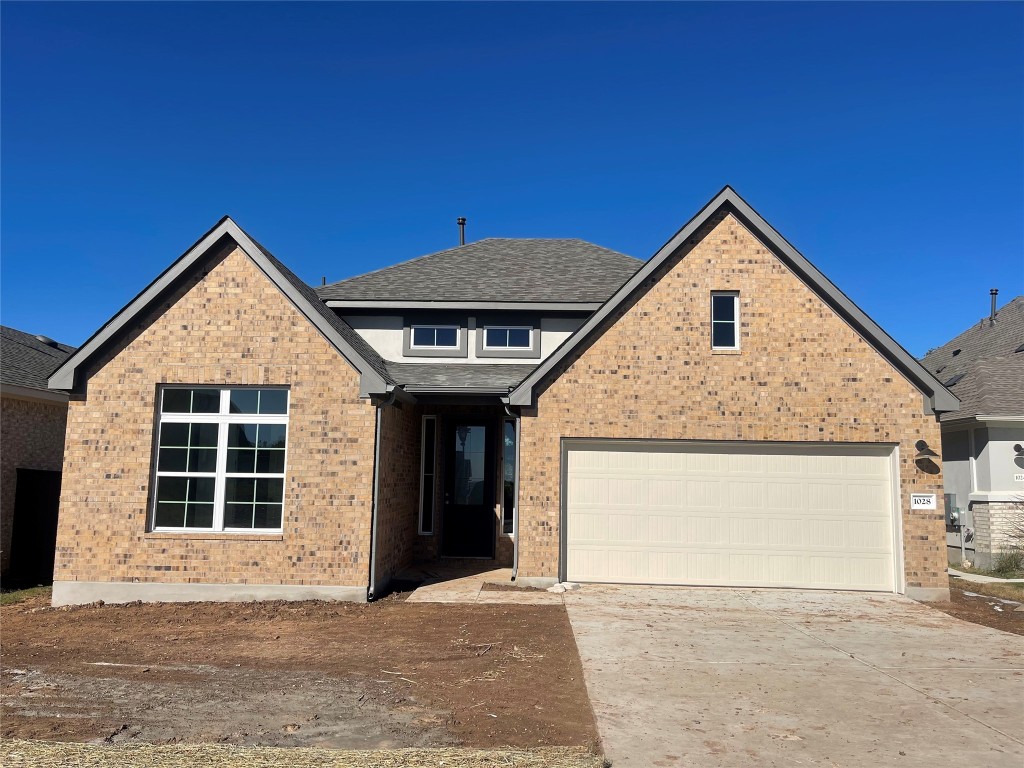 a view of front of house with garage