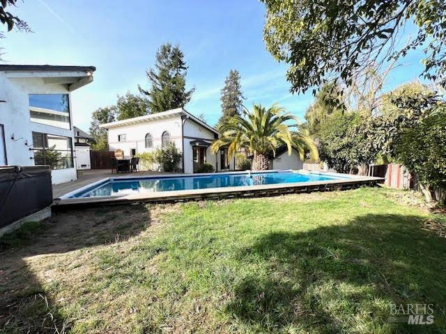 Property consits of a two bed, two bath main house plus pool house, garage, pool and pump house on .30 acres. This is the view from the backyard.