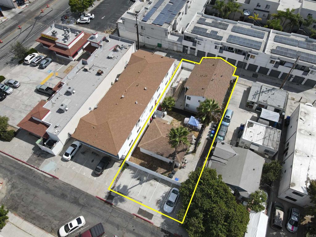 an aerial view of a house with a yard