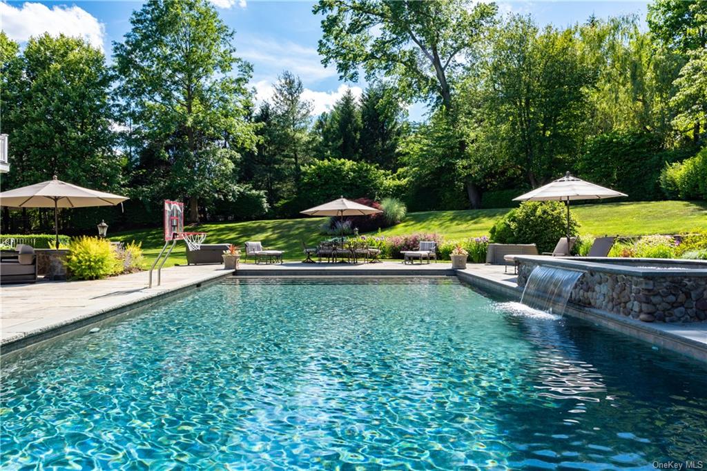 a view of a garden with an outdoor seating