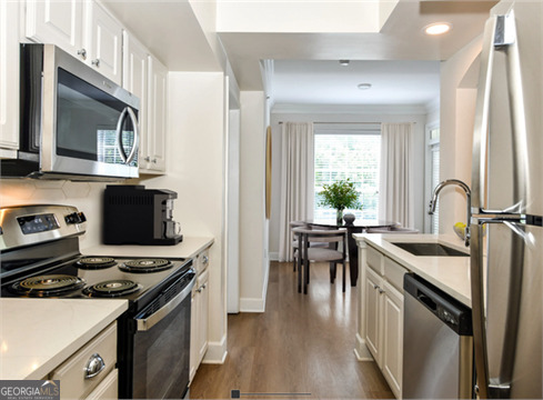 a kitchen with a stove and a microwave