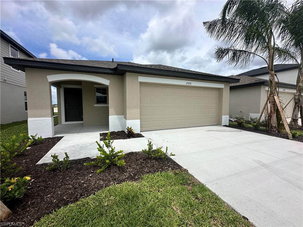 View of front of property with a garage