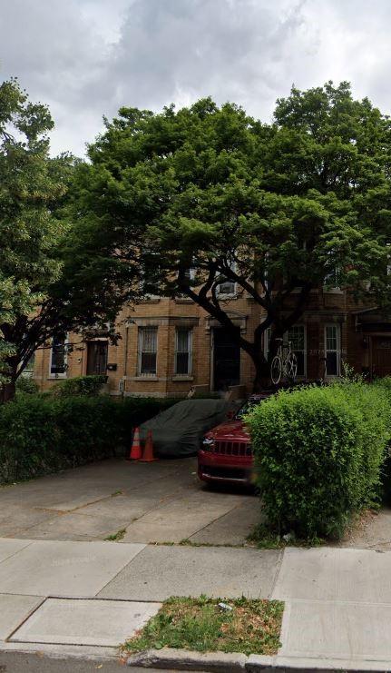 a car parked in front of a house