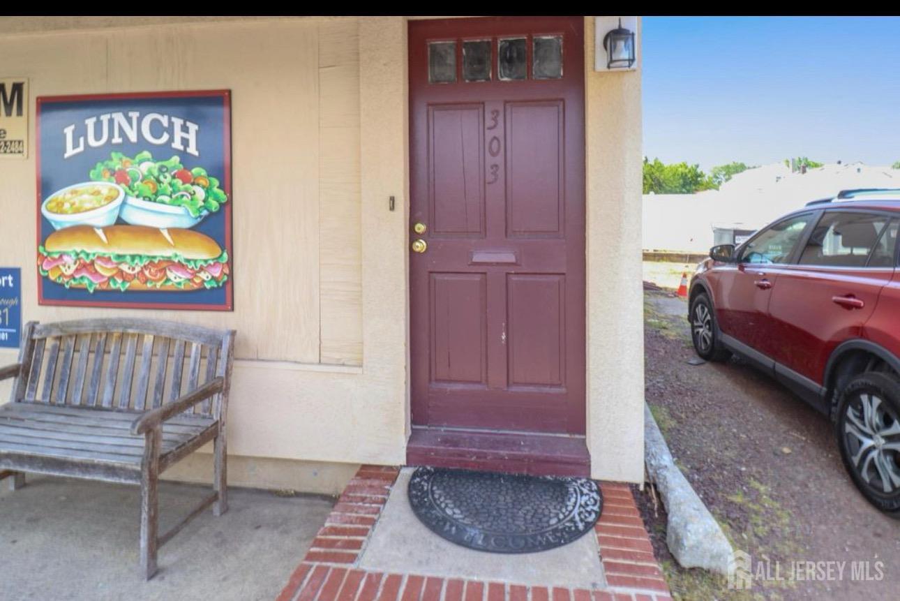 a view of front door with outdoor seating