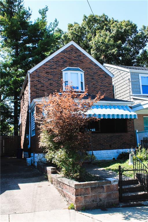 a house with trees in the background