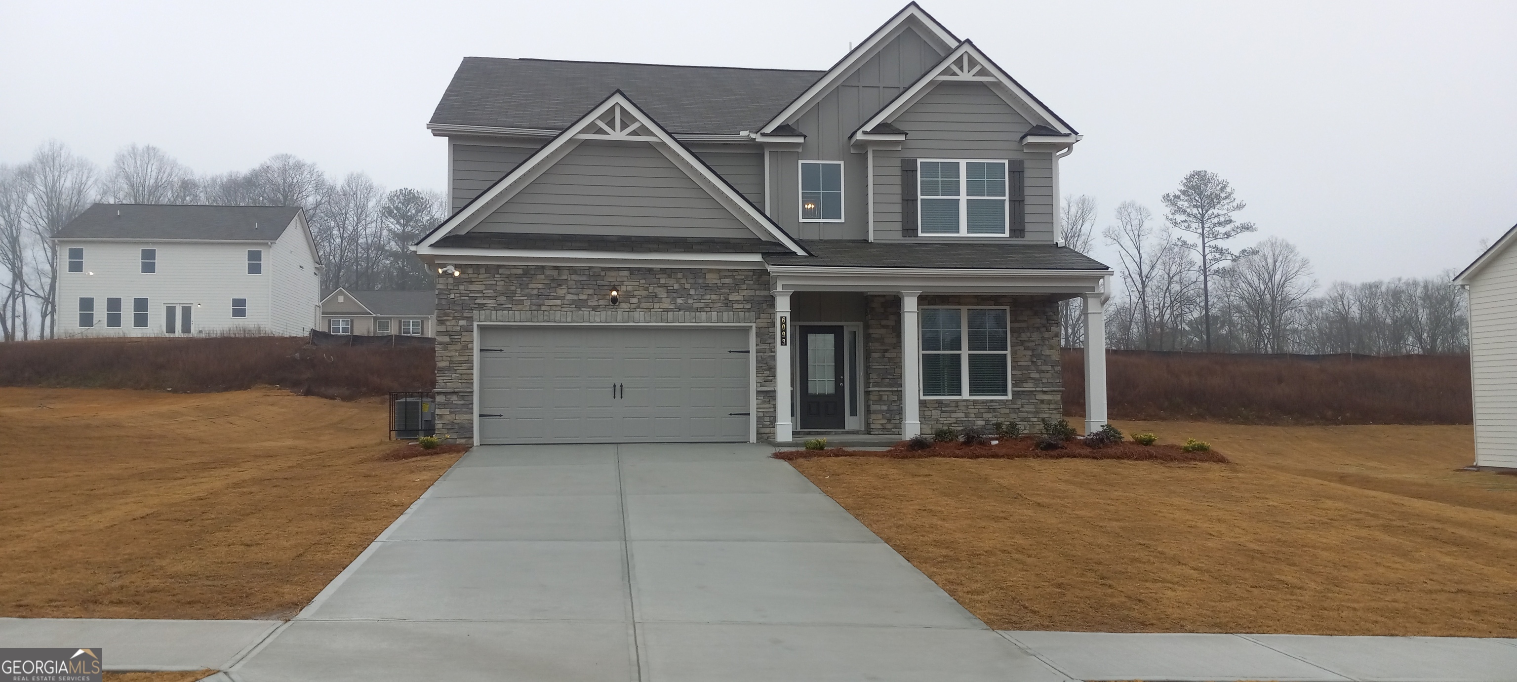 front view of a house with a yard