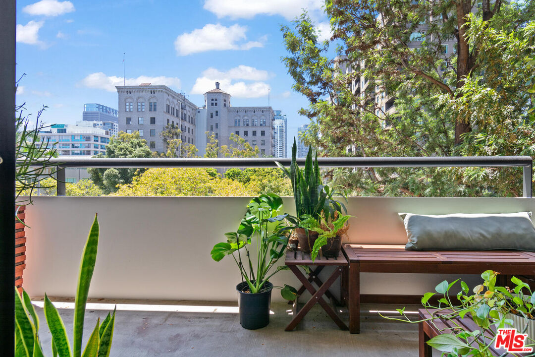 a view of a balcony with chairs