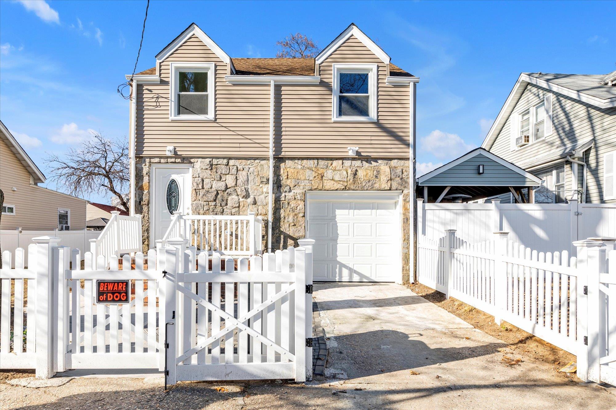 View of front of house with a garage