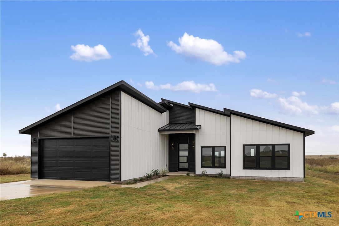 a view of a house with a garage