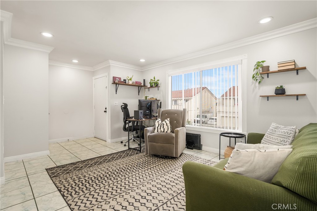 Welcome Home! Note the beautiful crown mouldings, recessed lighting, low-maintenance tile flooring, and light/bright interior!