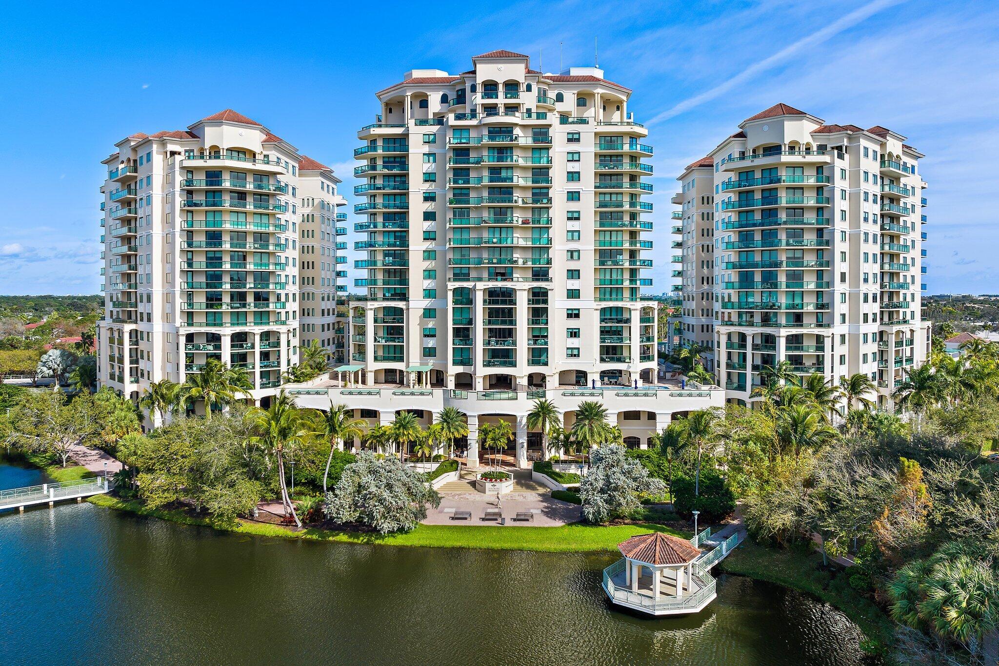 a view of a building with garden space and lake view