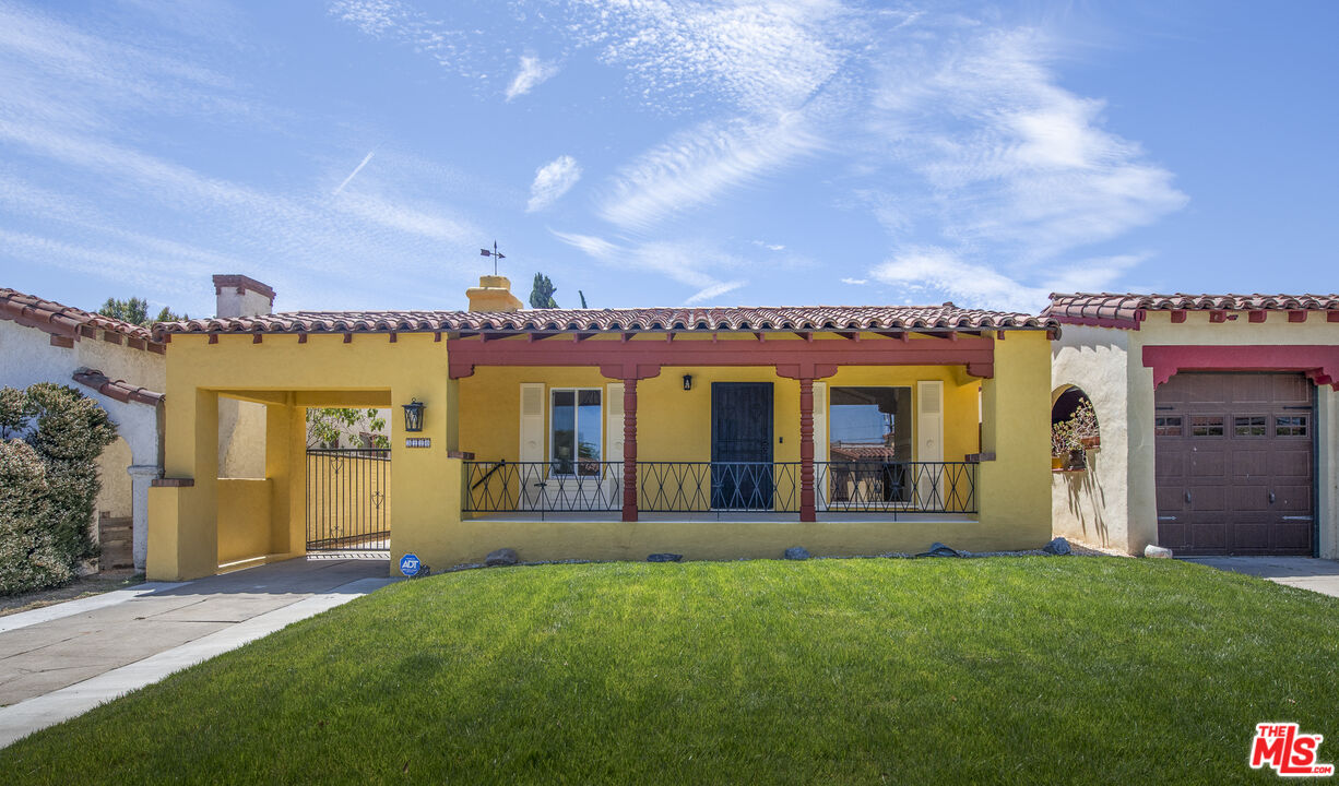 front view of a house with a garden