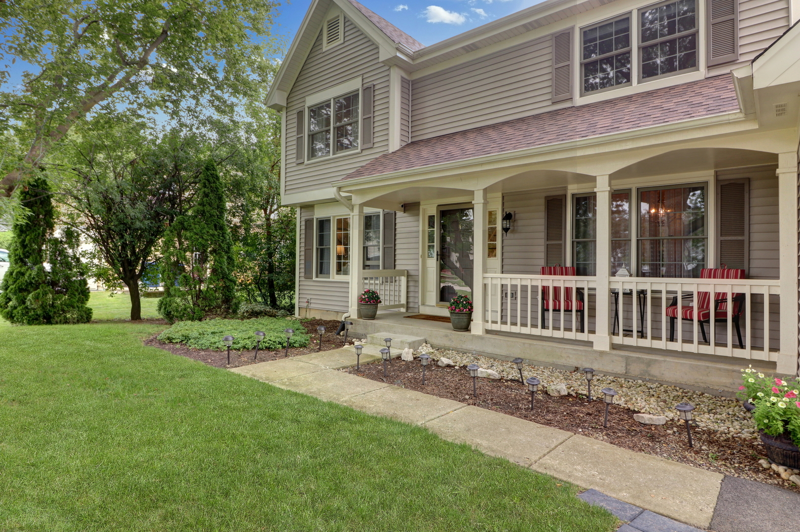 front view of a house with a yard