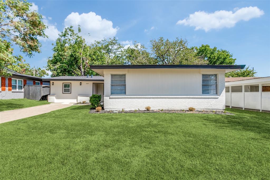 front view of a house with a yard