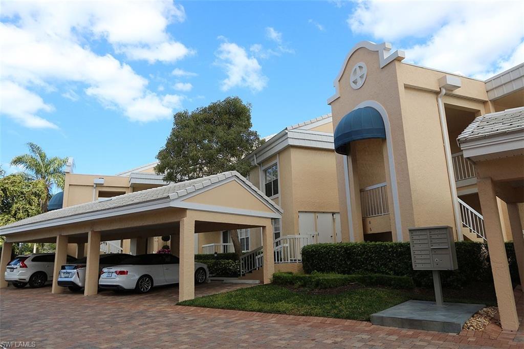 a front view of a building with parking space