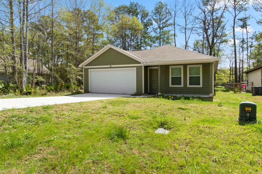 a front view of a house with yard