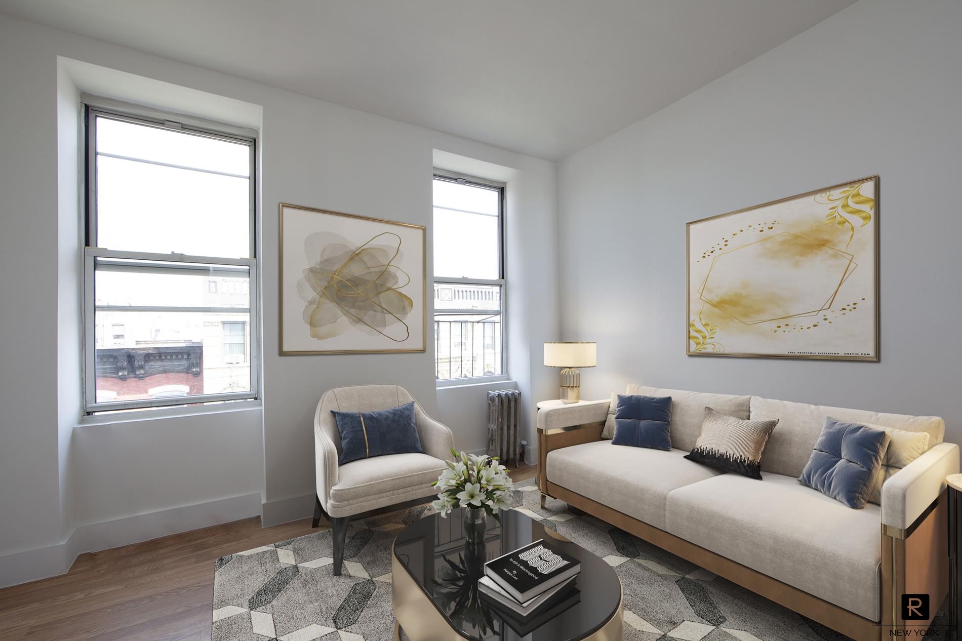 a living room with furniture and a window with wooden floor