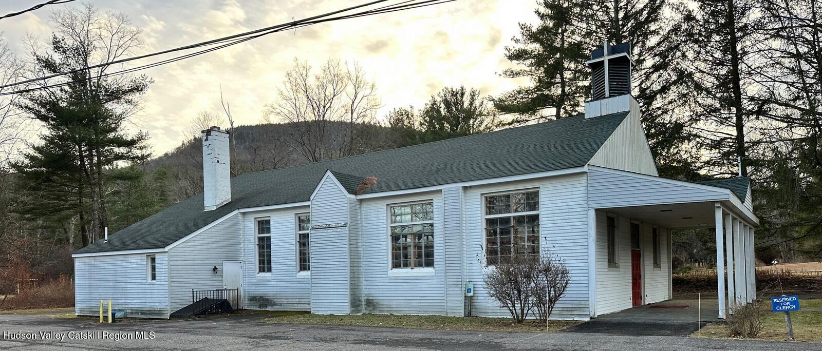 a view of a house with a tree