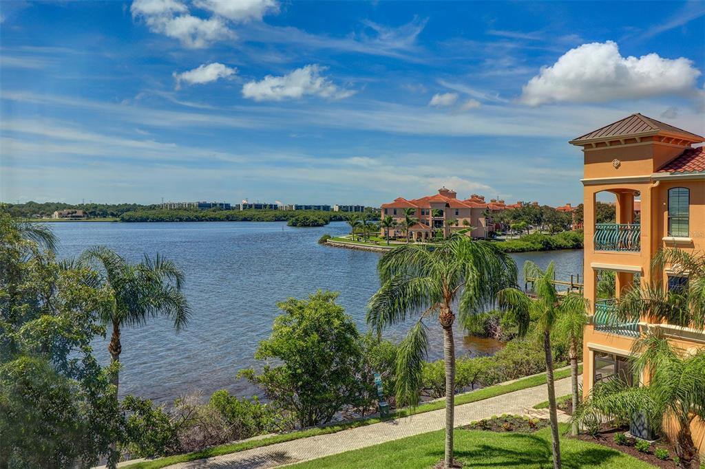 a view of a lake with a beach in front of it