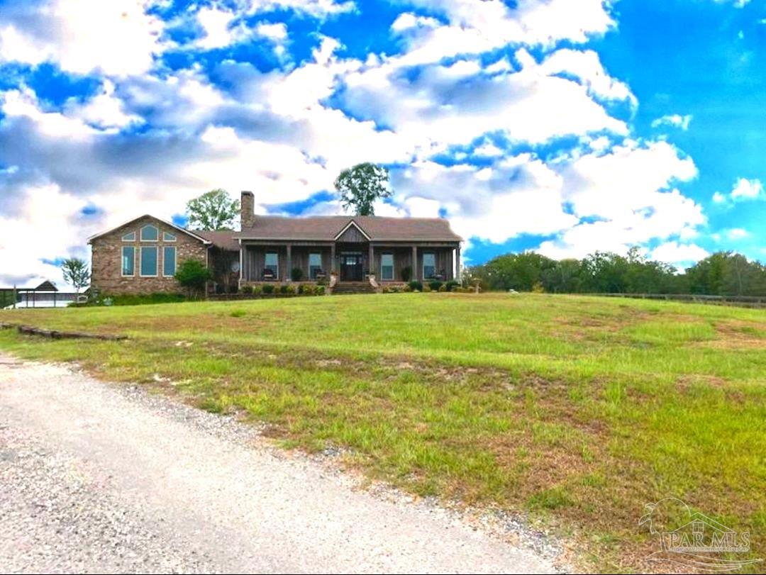 a view of a house with a big yard