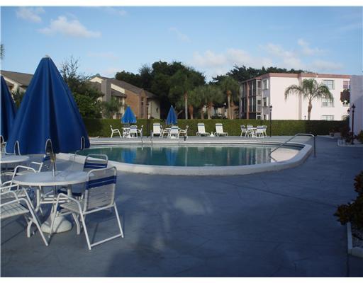 a view of a chairs and tables in the patio