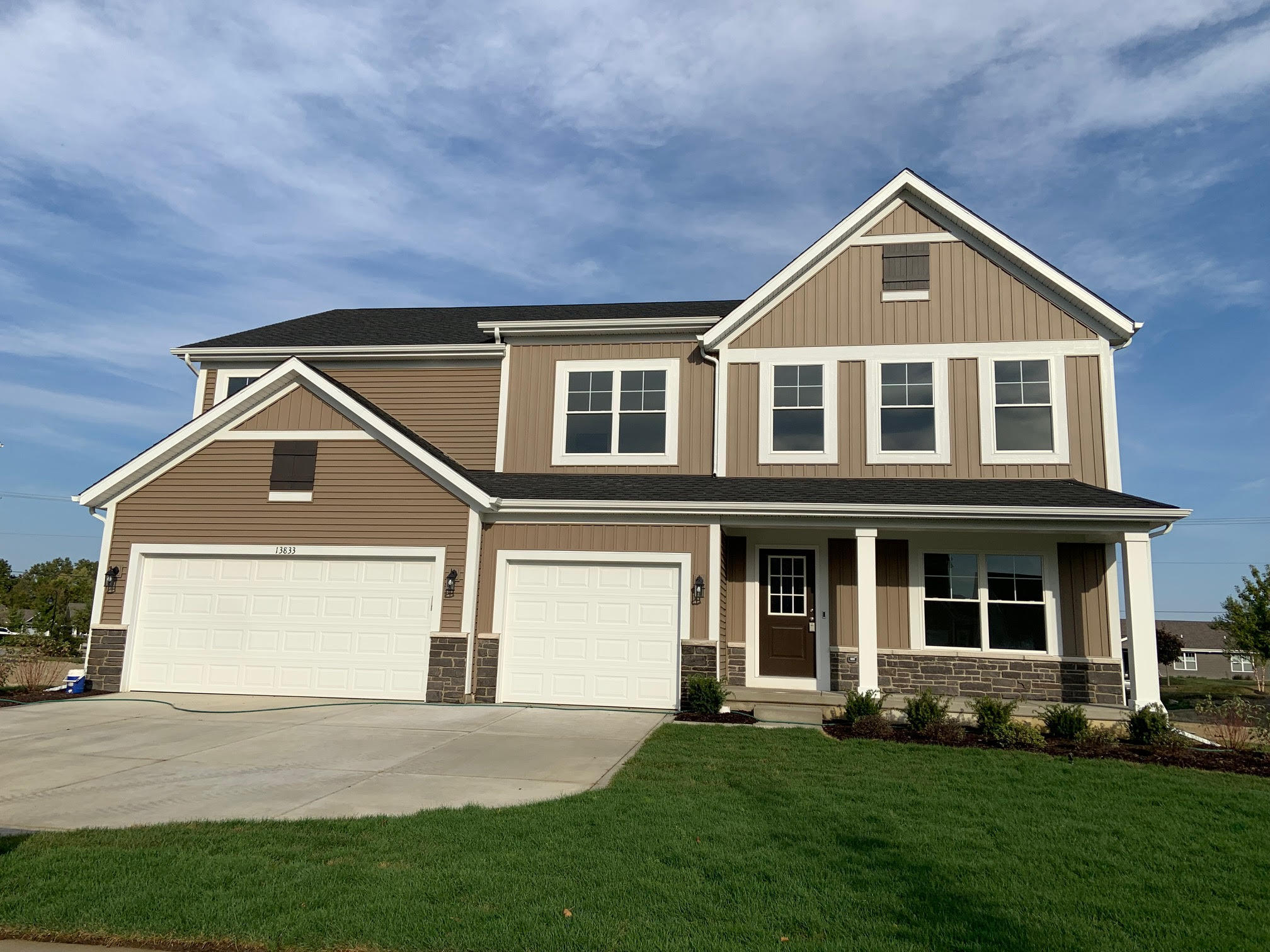 front view of a house with a yard