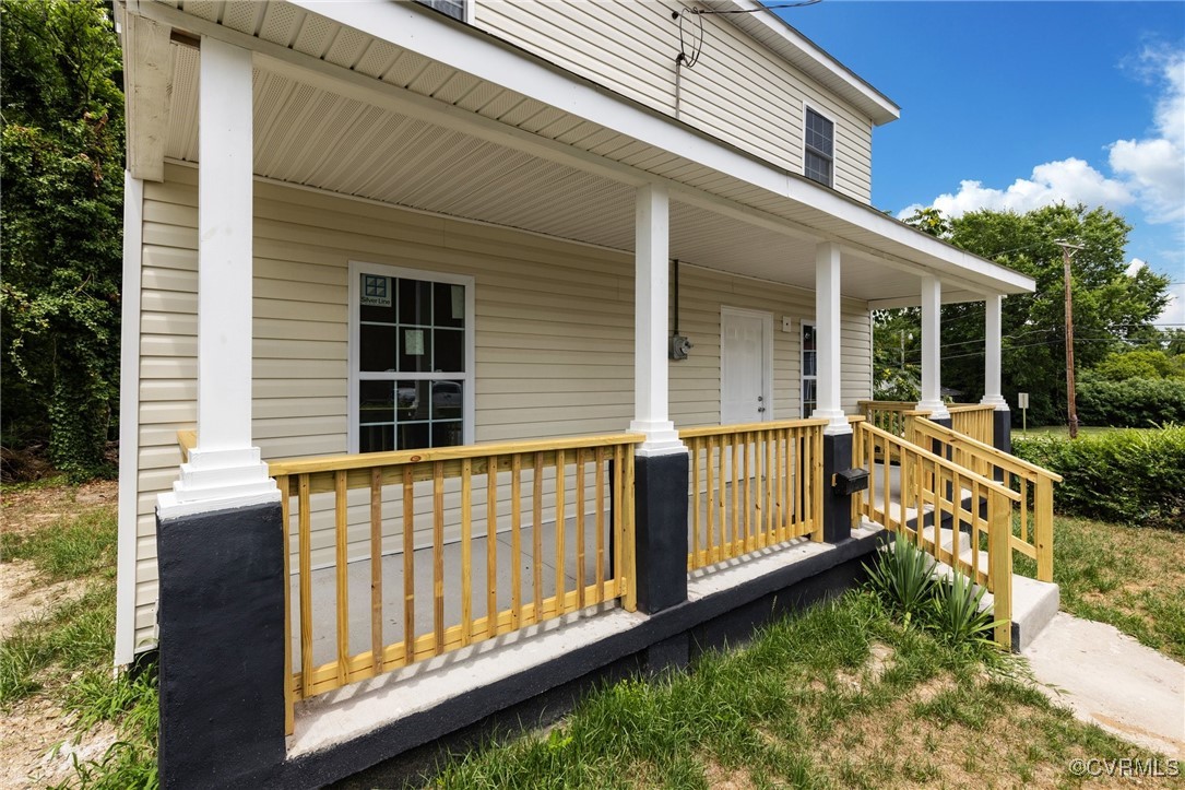 a view of a house with wooden fence