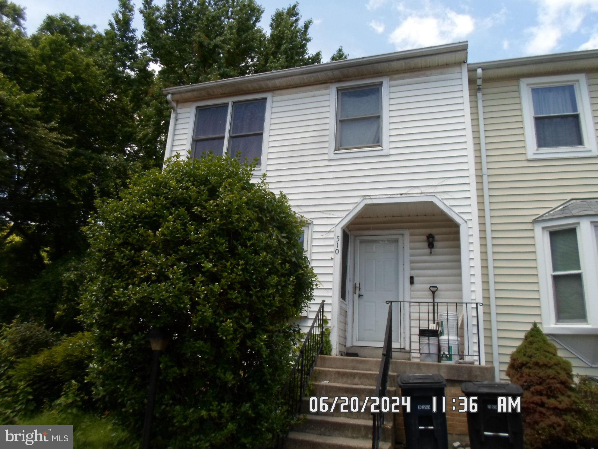 a front view of house with yard outdoor seating and yard