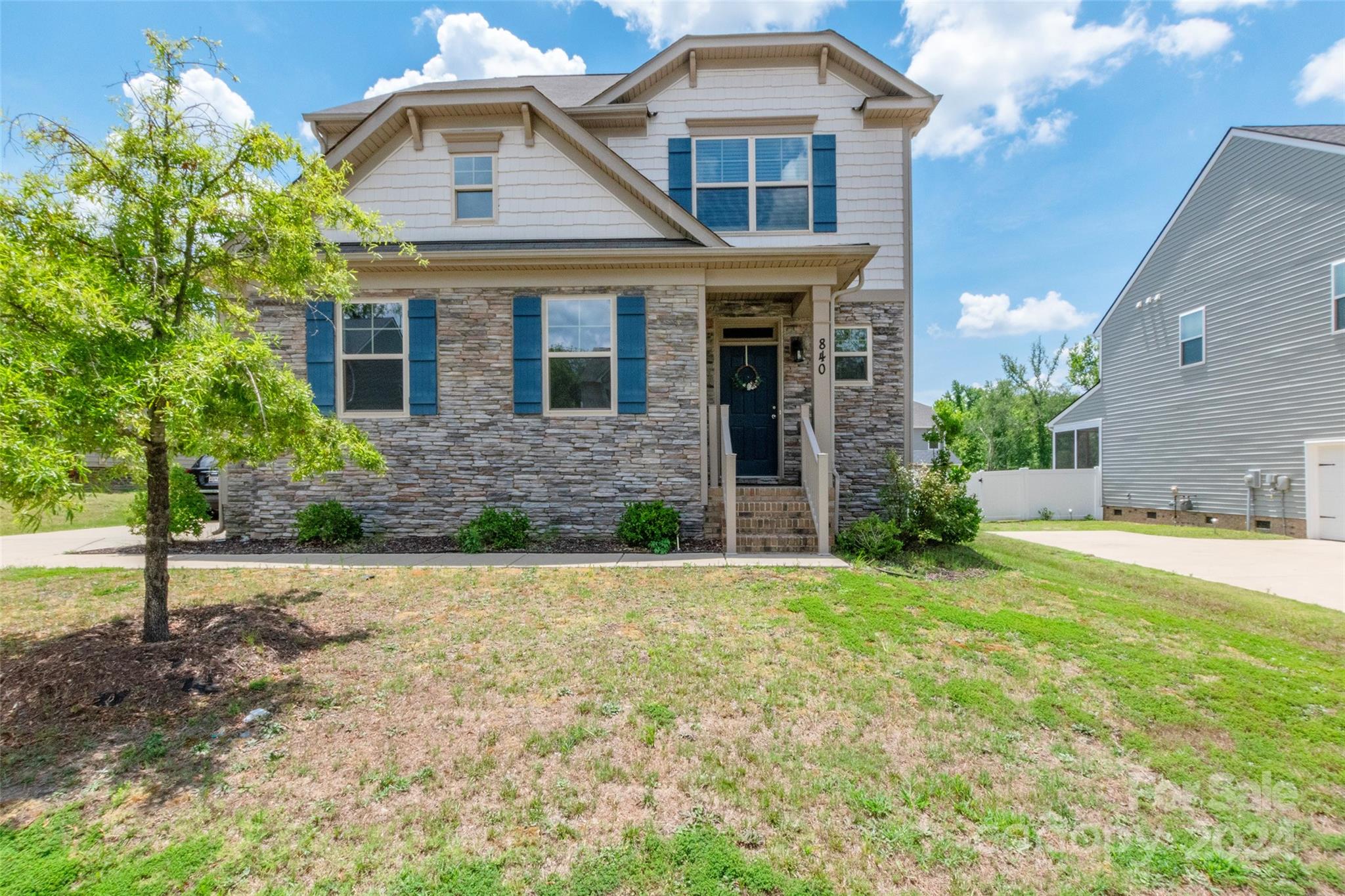 a front view of a house with a yard