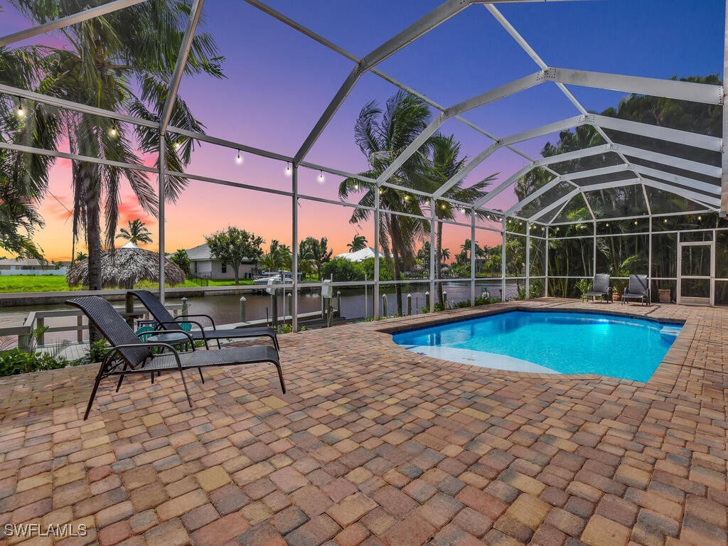 a view of a swimming pool with a patio