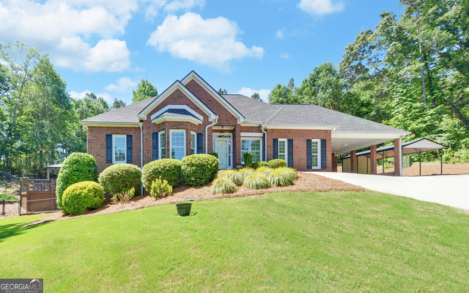 a front view of house with yard and green space