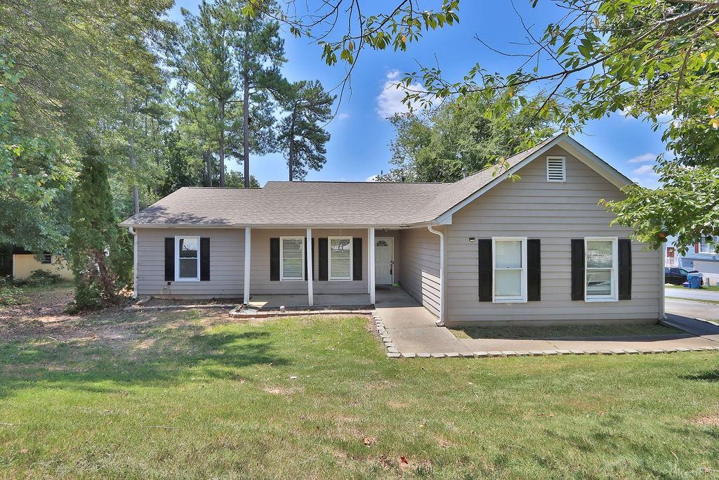 front view of a house with a yard