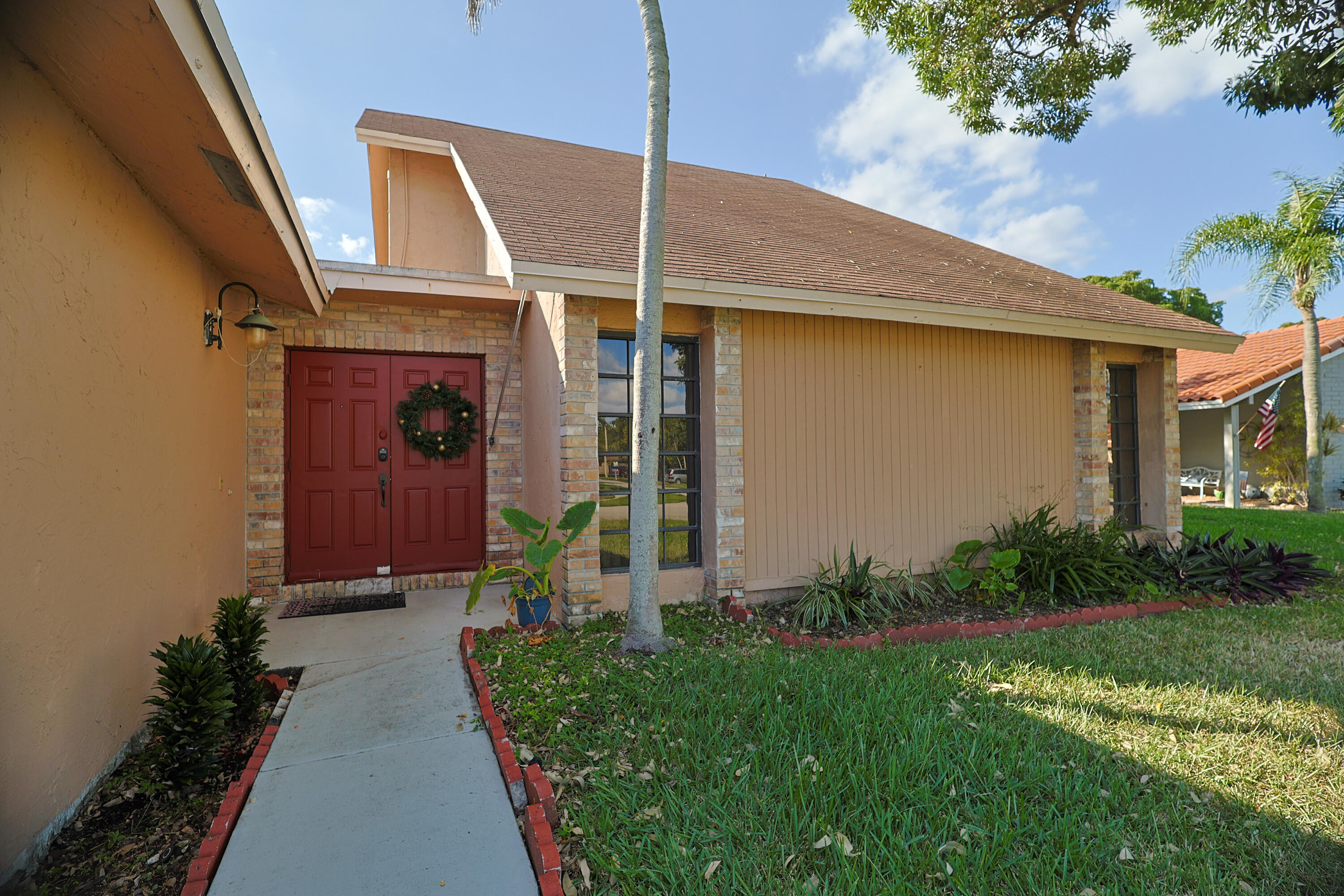 a front view of a house with garden