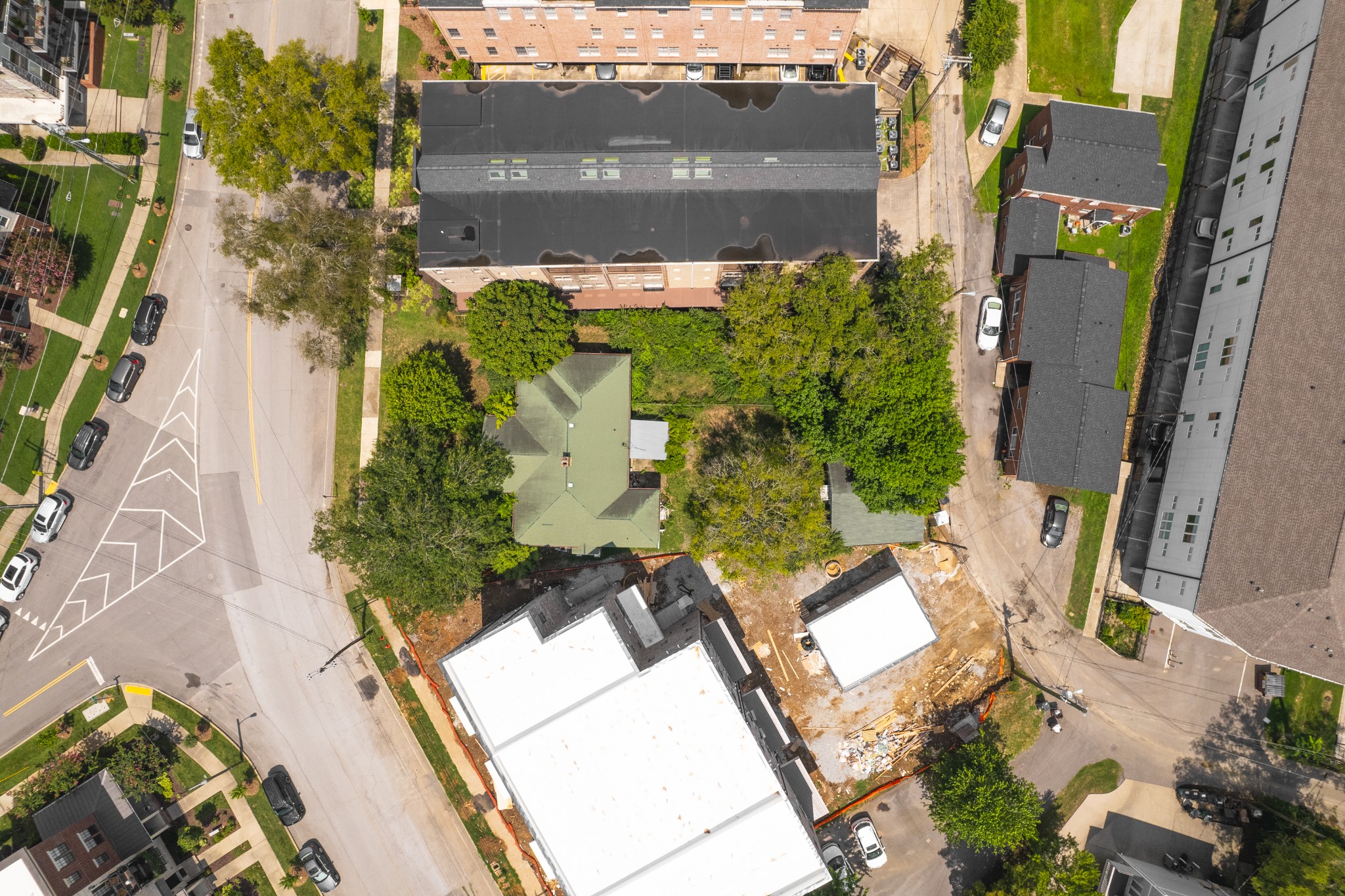 an aerial view of a residential apartment building with a yard