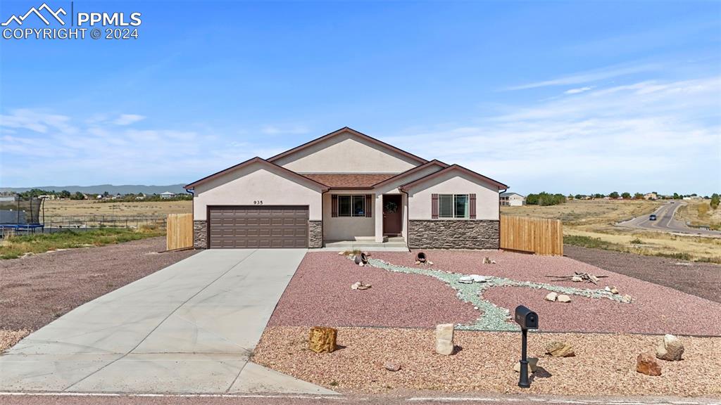 Single story home with a garage