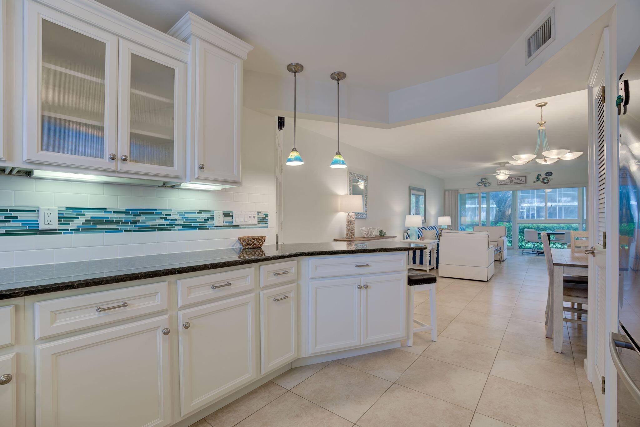 a kitchen with sink and cabinets