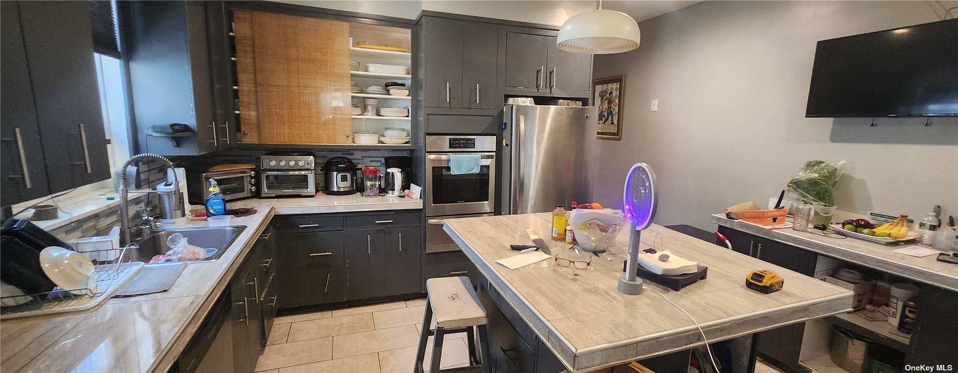 a view of kitchen and dining area with furniture