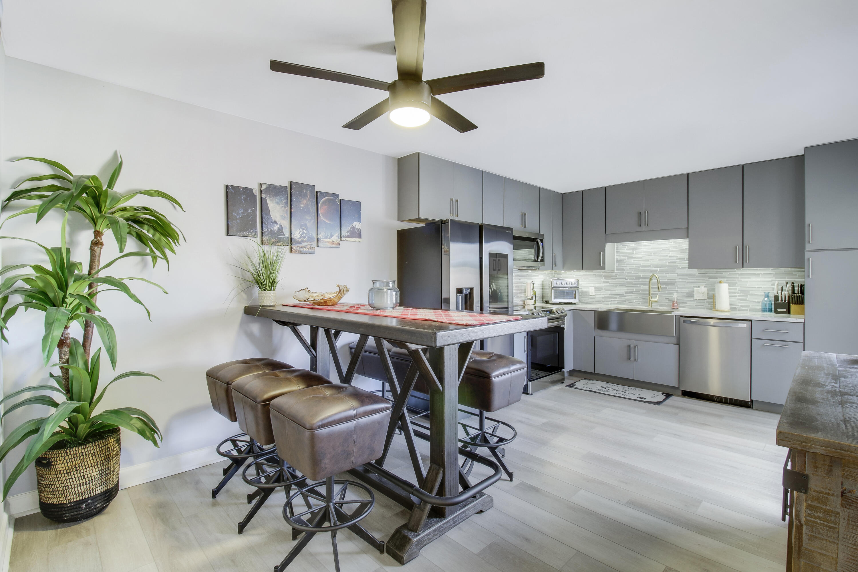 a kitchen with a table and chairs in it