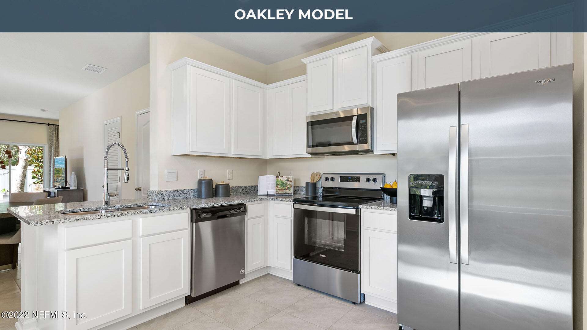 a kitchen with a sink stainless steel appliances and white cabinets