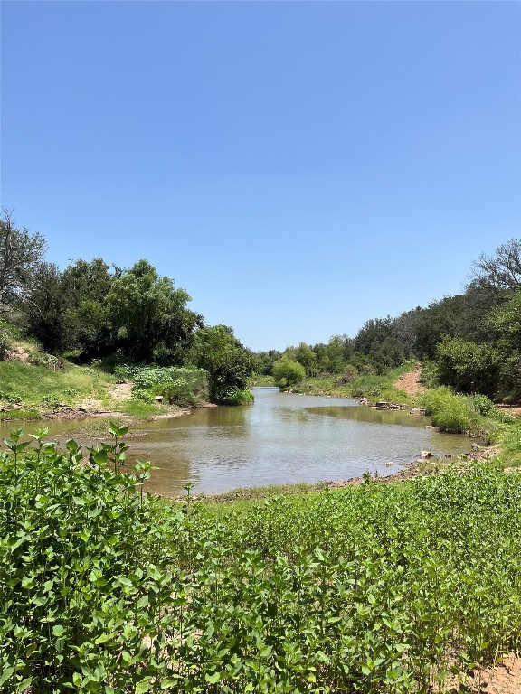 a view of a lake with a big yard