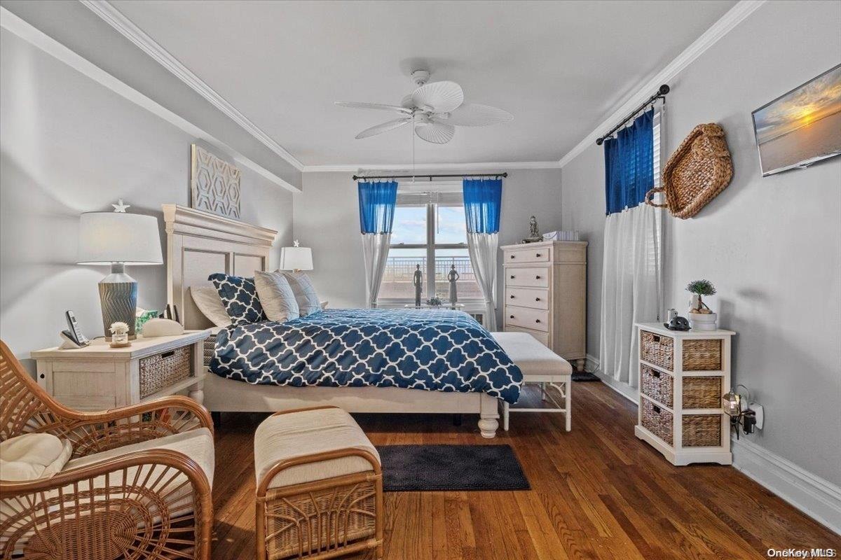 a bedroom with furniture and wooden floor