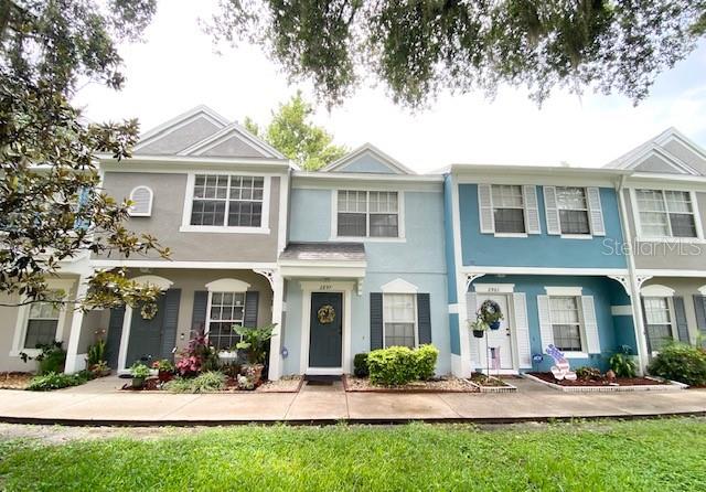 a front view of a house with yard